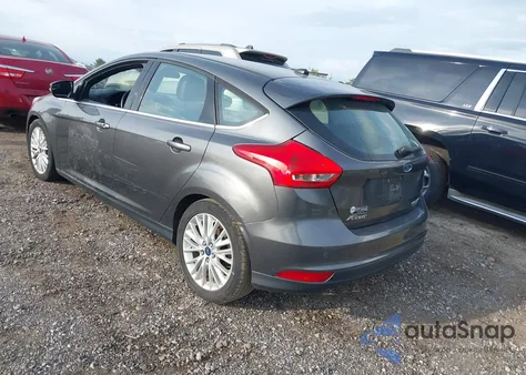 2015 Ford Focus Titanium from USA, damaged, VIN 1FADP3N27FL260899